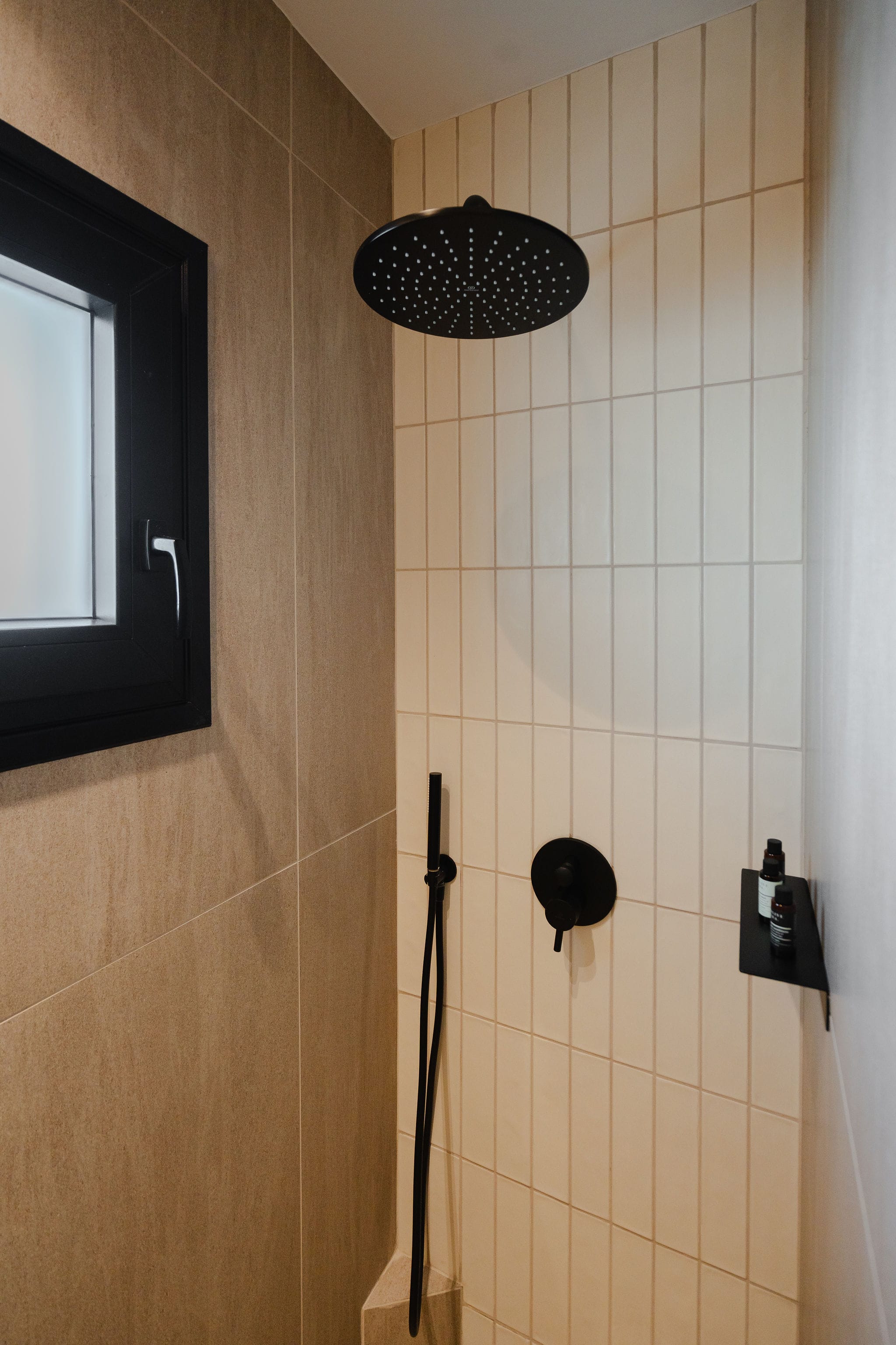 a shower with a black lamp