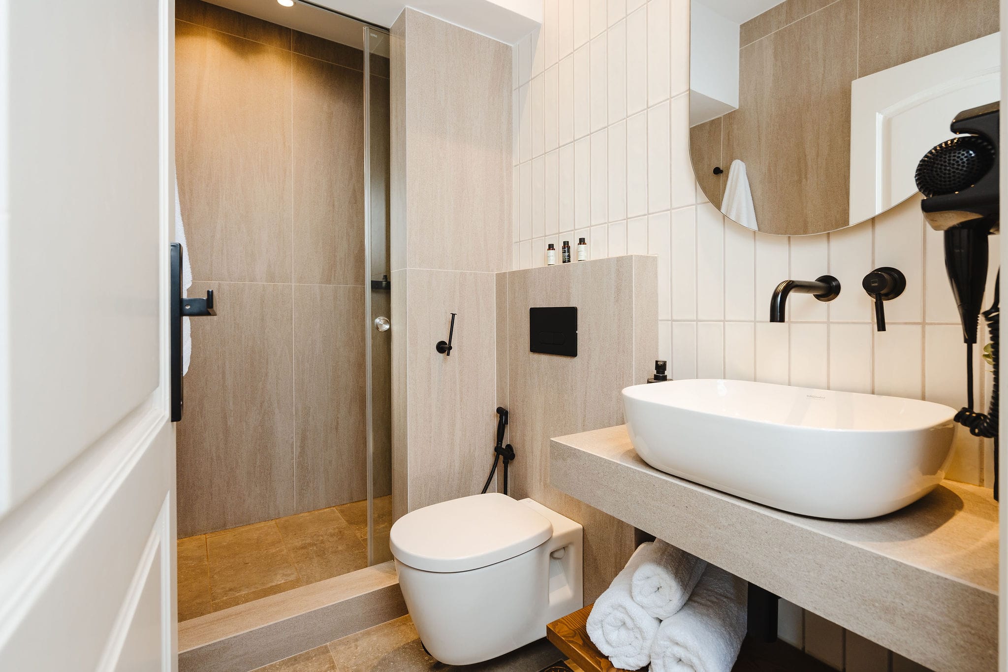 a bathroom with a sink toilet and a shower