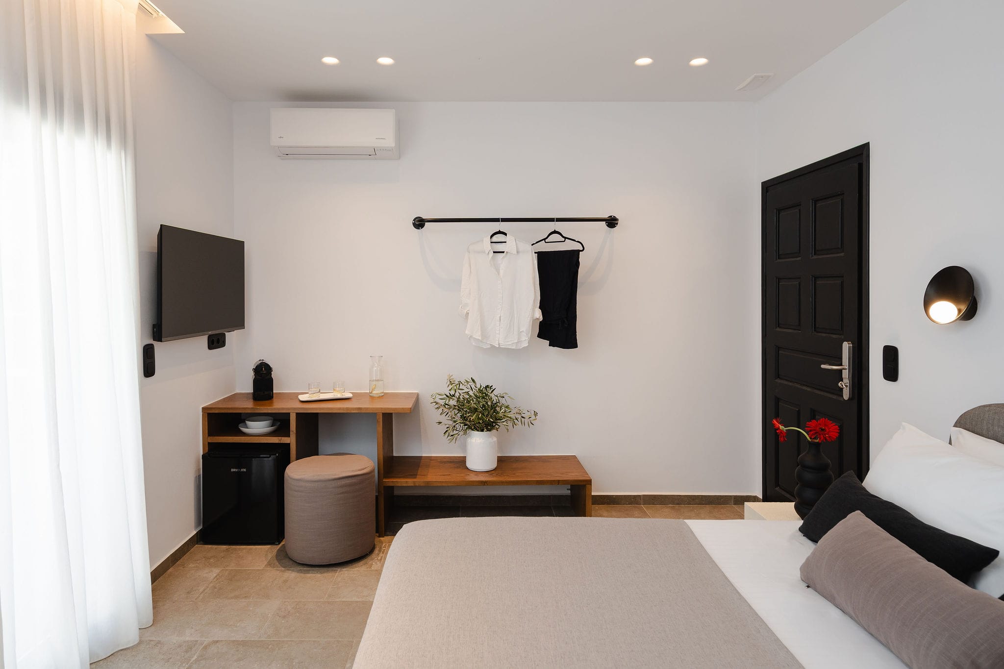 a room with a bed and a desk