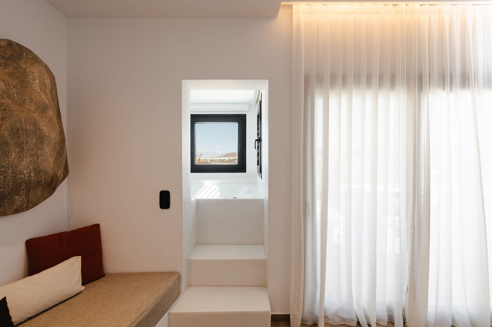 a room with a bed and a mirror