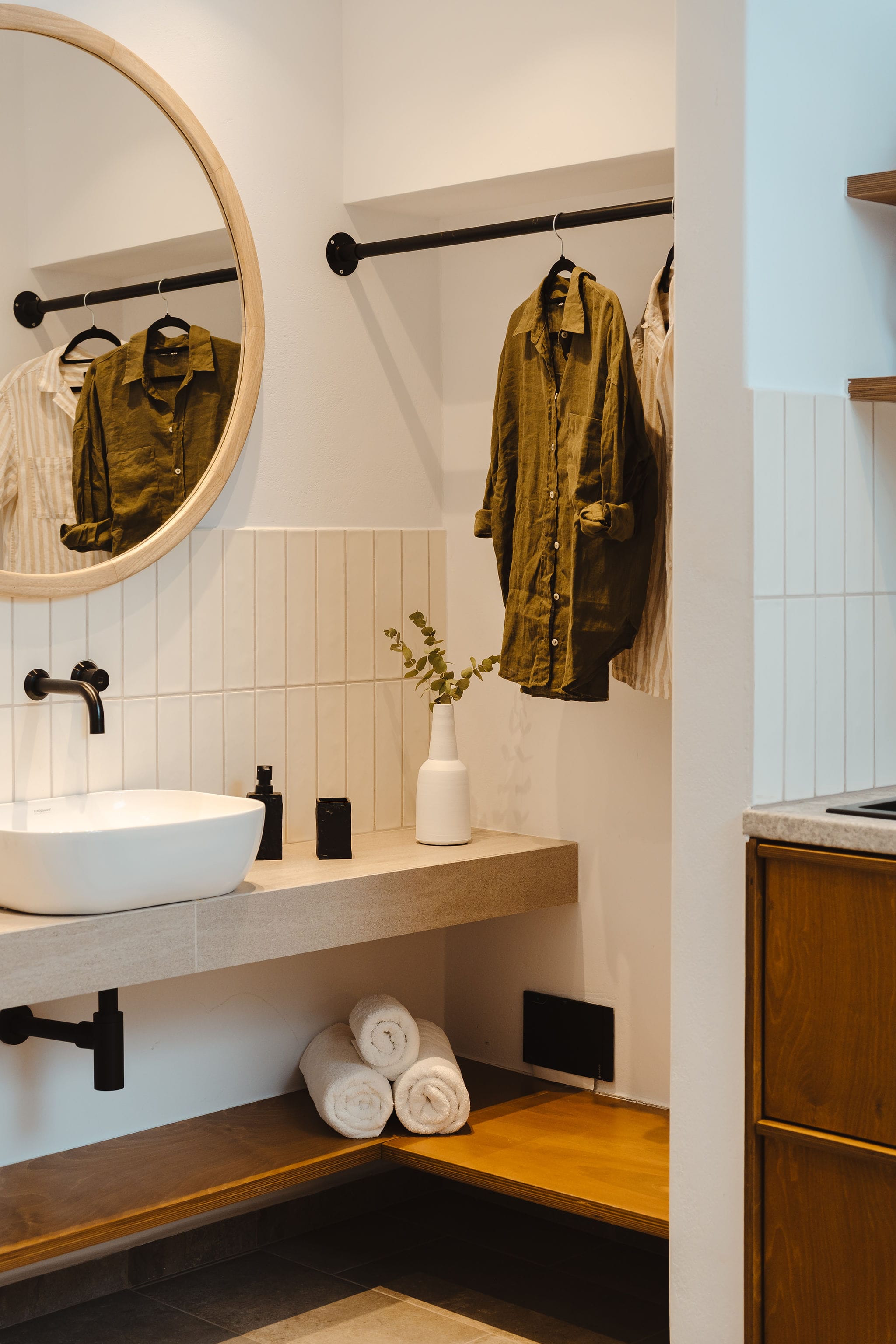 a bathroom with a towel on the wall