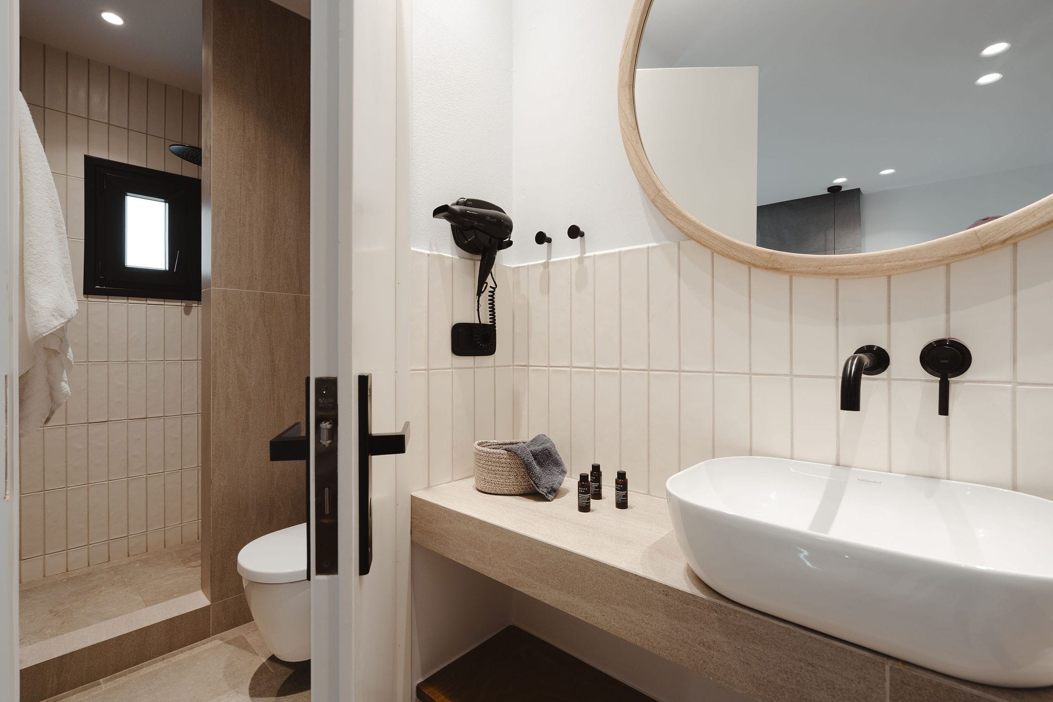 a bathroom with a tub and toilet