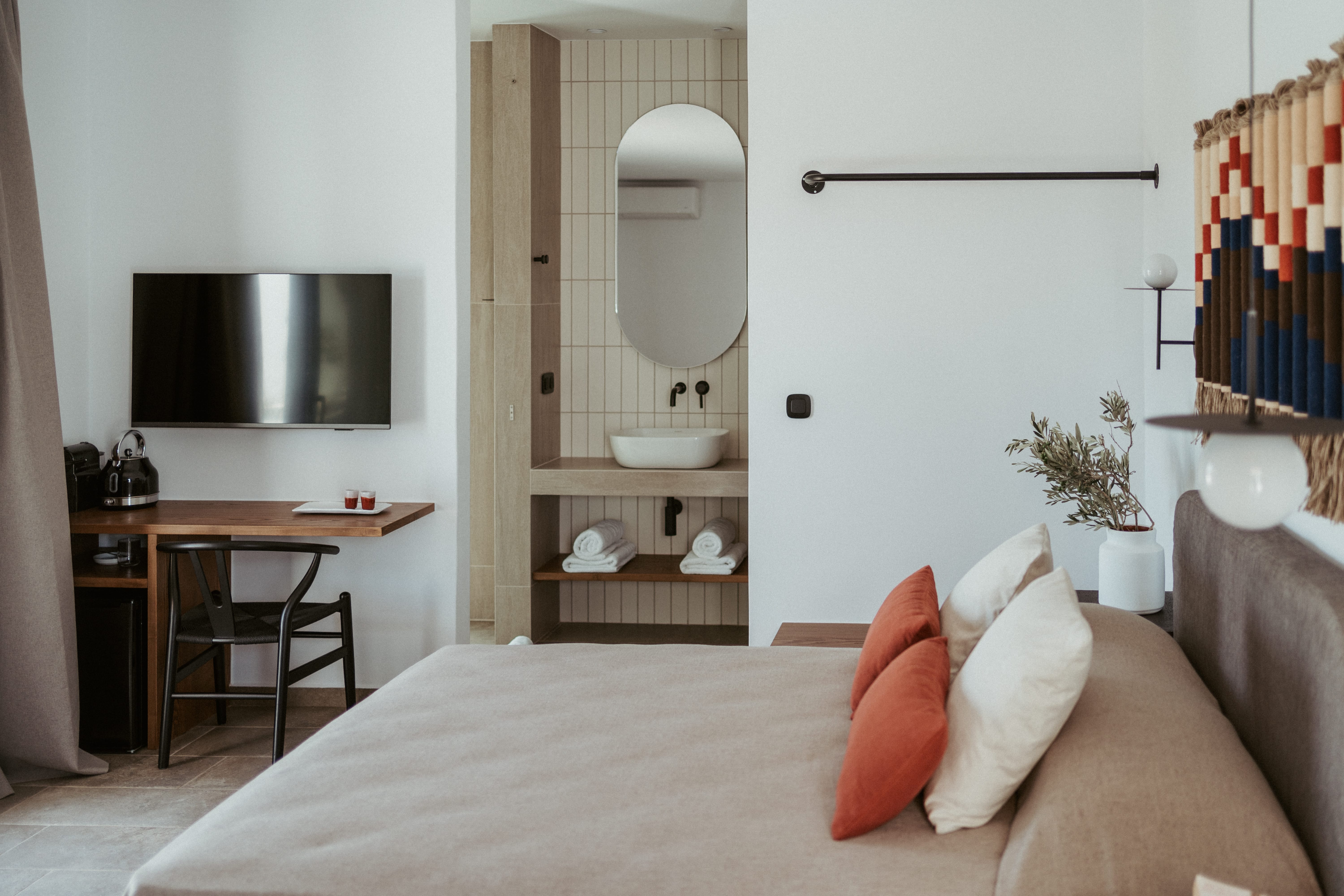 a bedroom with a bed and a mirror