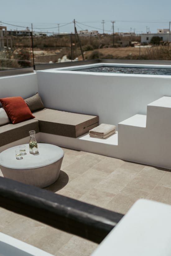 a white couch and a table