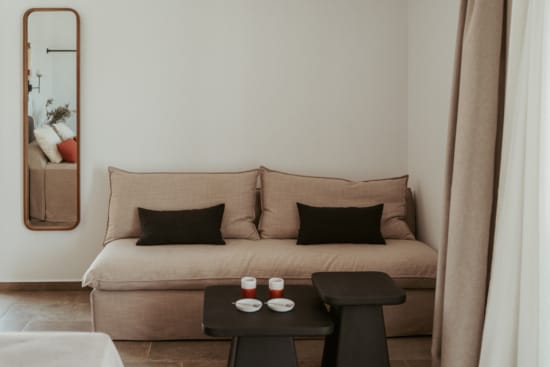 a couch with candles on it