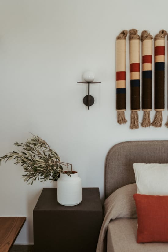 a vase with a plant on a table