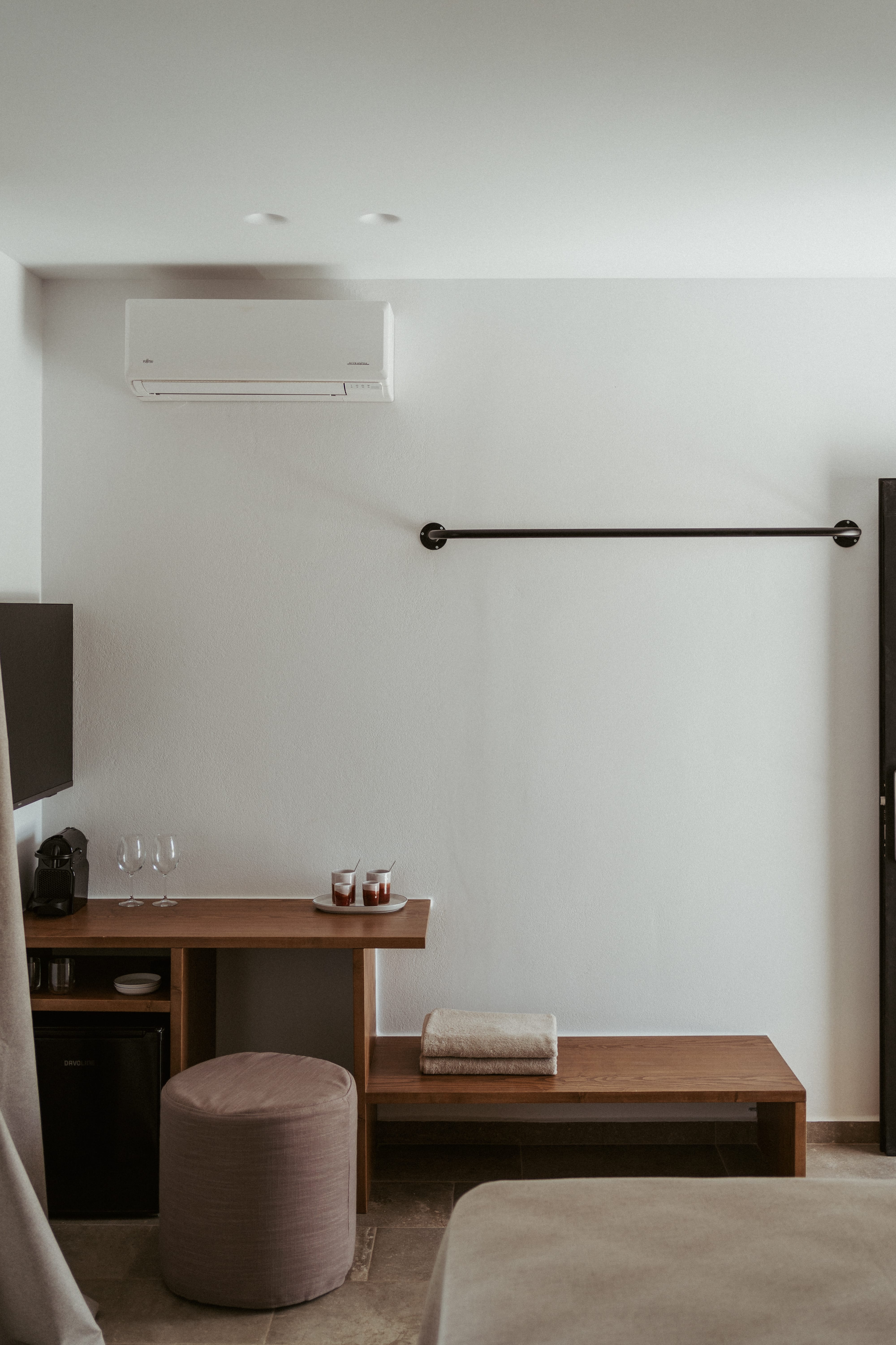 a white wall with a black bar