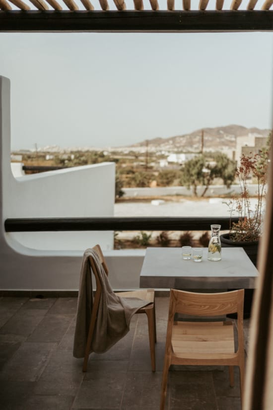 a table and chairs on a balcony