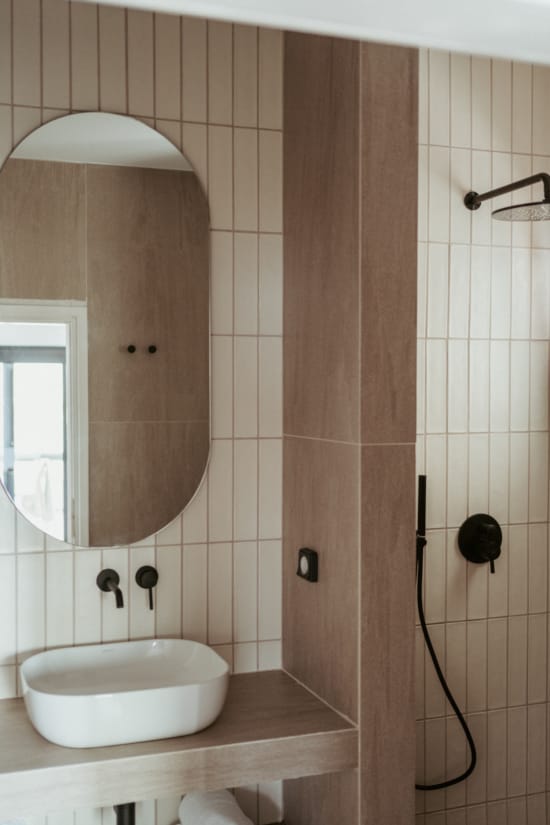 a bathroom with a mirror and sink