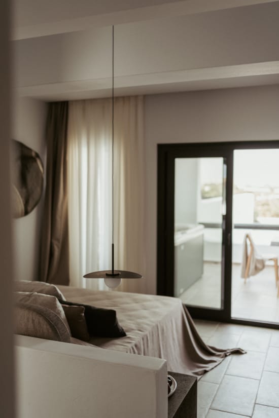 a bedroom with a large mirror