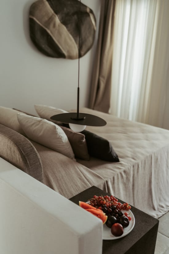 a couch with a table and a lamp