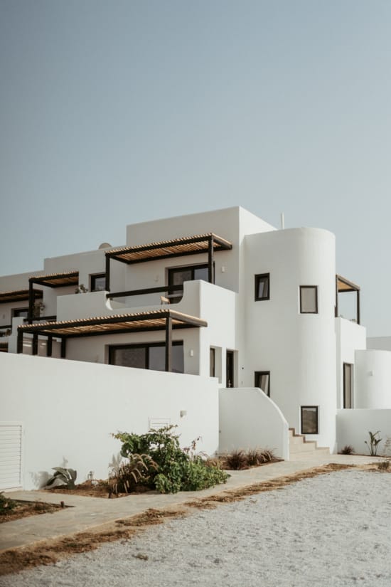 a white building with a fence around it