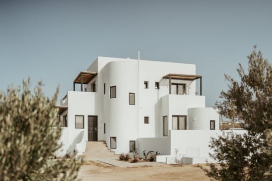 a white house with a driveway