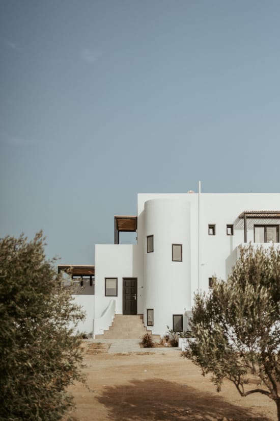 a white building with a small staircase