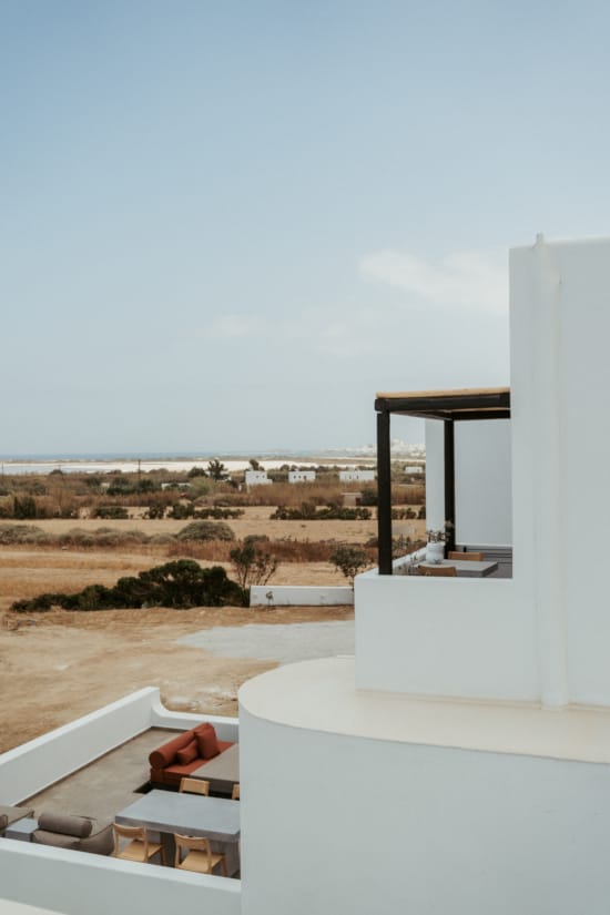 a view of a beach and ocean from a balcony