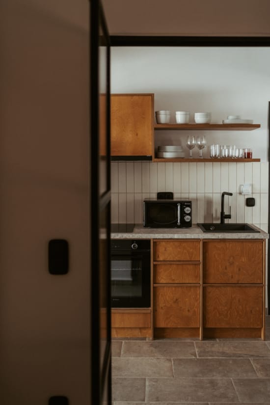 a kitchen with a microwave oven and cabinets
