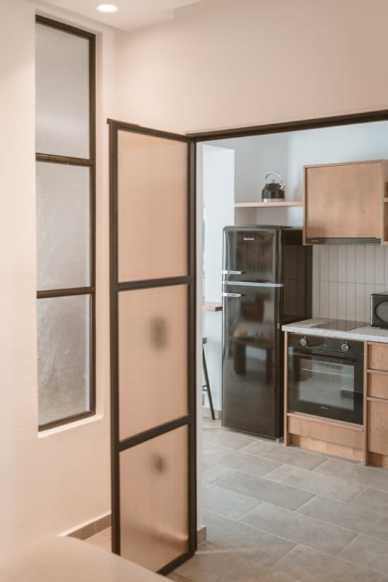 a kitchen with a refrigerator and oven