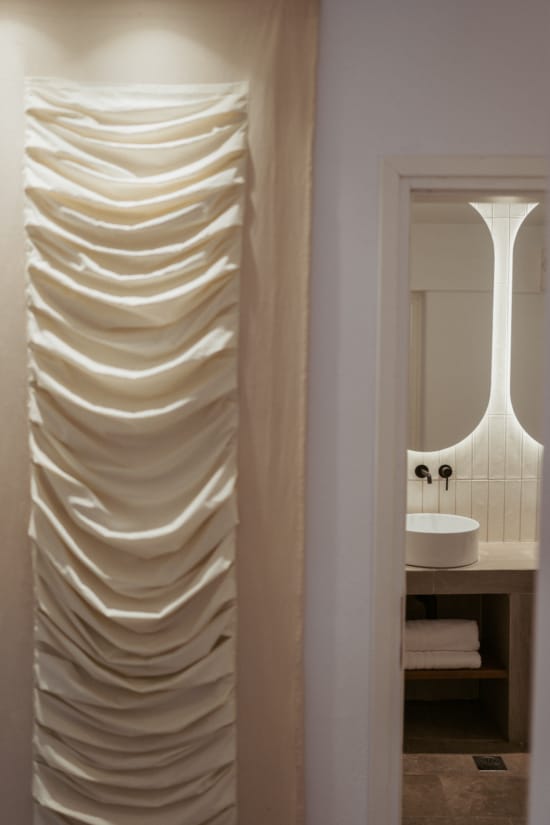 a bathroom with a white curtain