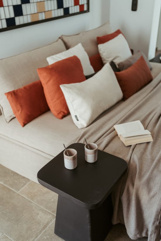 a bed with a table and pillows