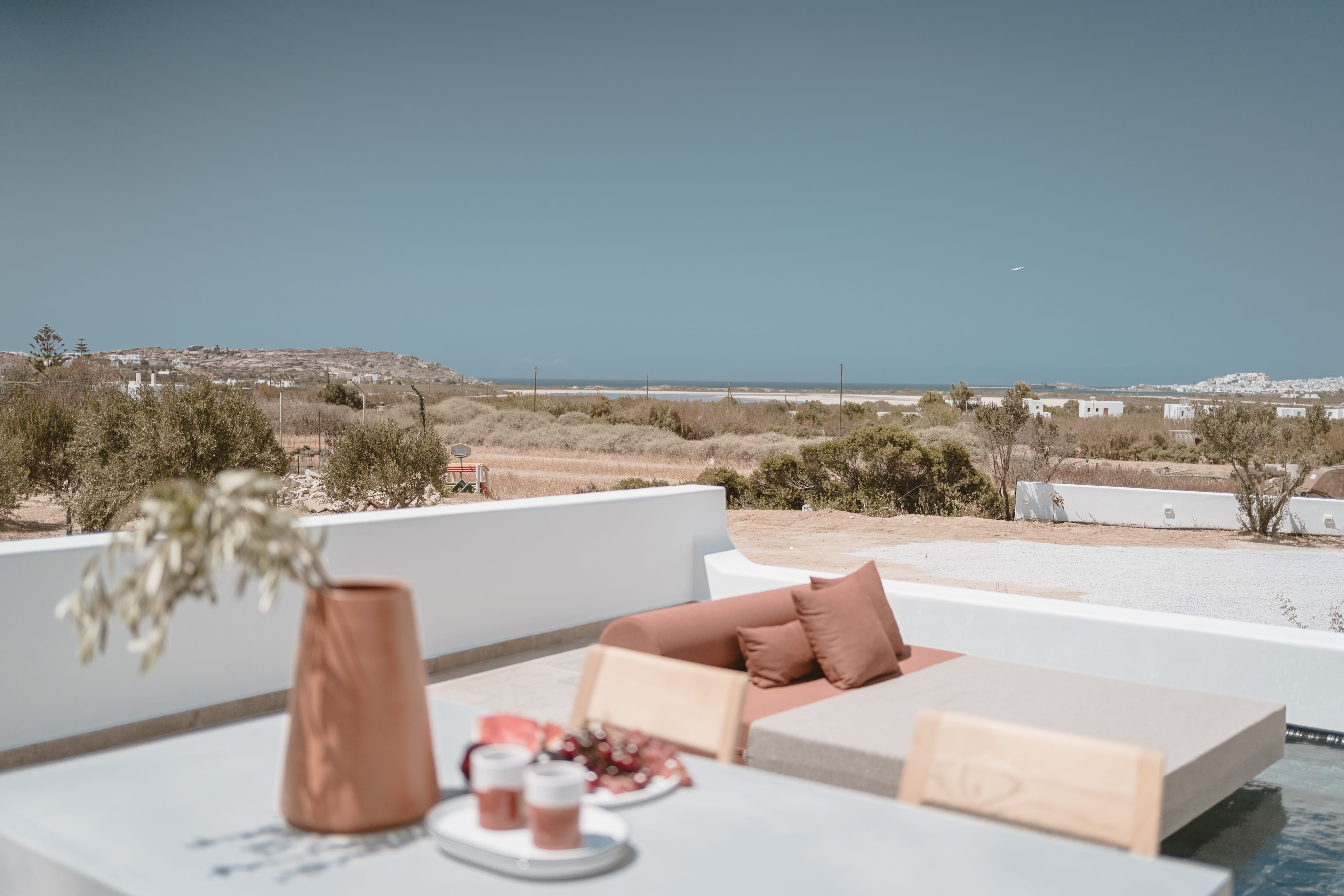 a table with a white couch and a white table with a white table and a white table with