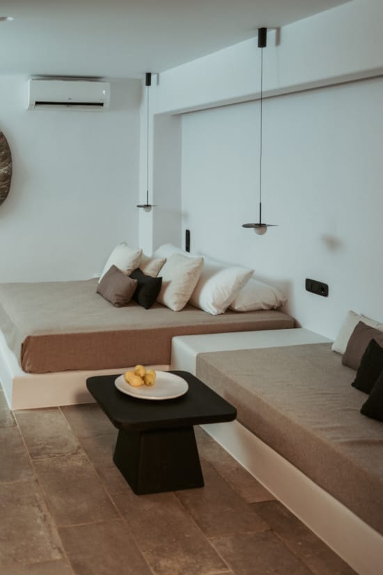 a couch and a coffee table in a room with a wood floor