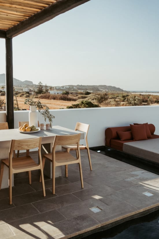 a table and chairs on a deck