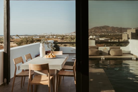 a table and chairs on a balcony