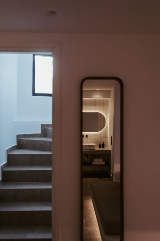 a bathroom with a mirror and a sink