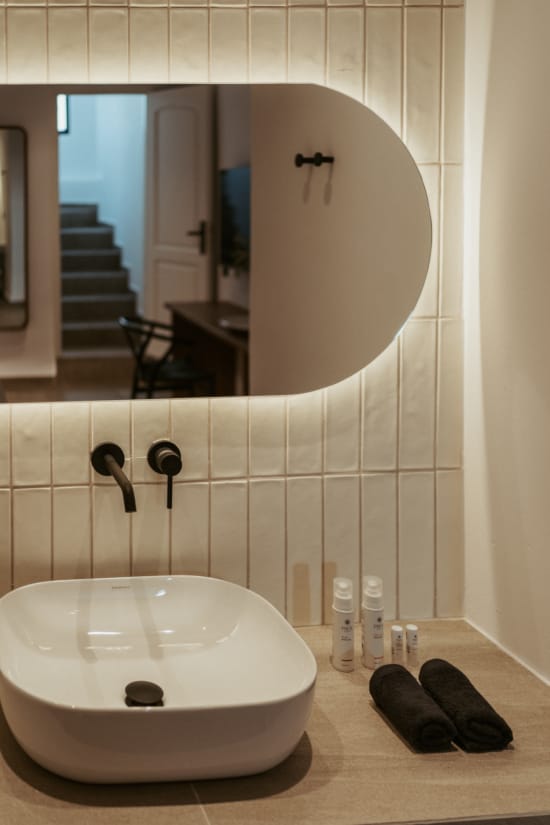 a bathroom with a large mirror