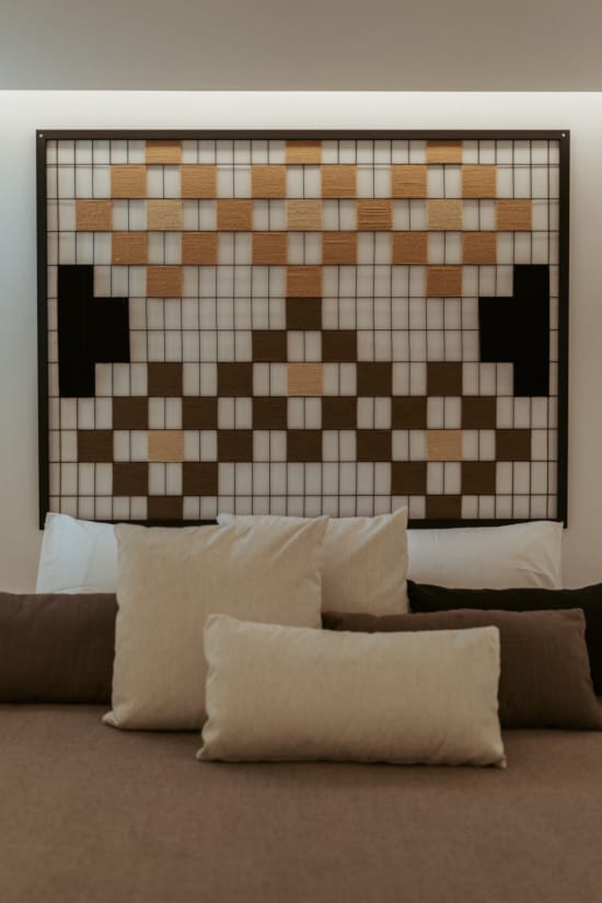 a room with a wall of tiles