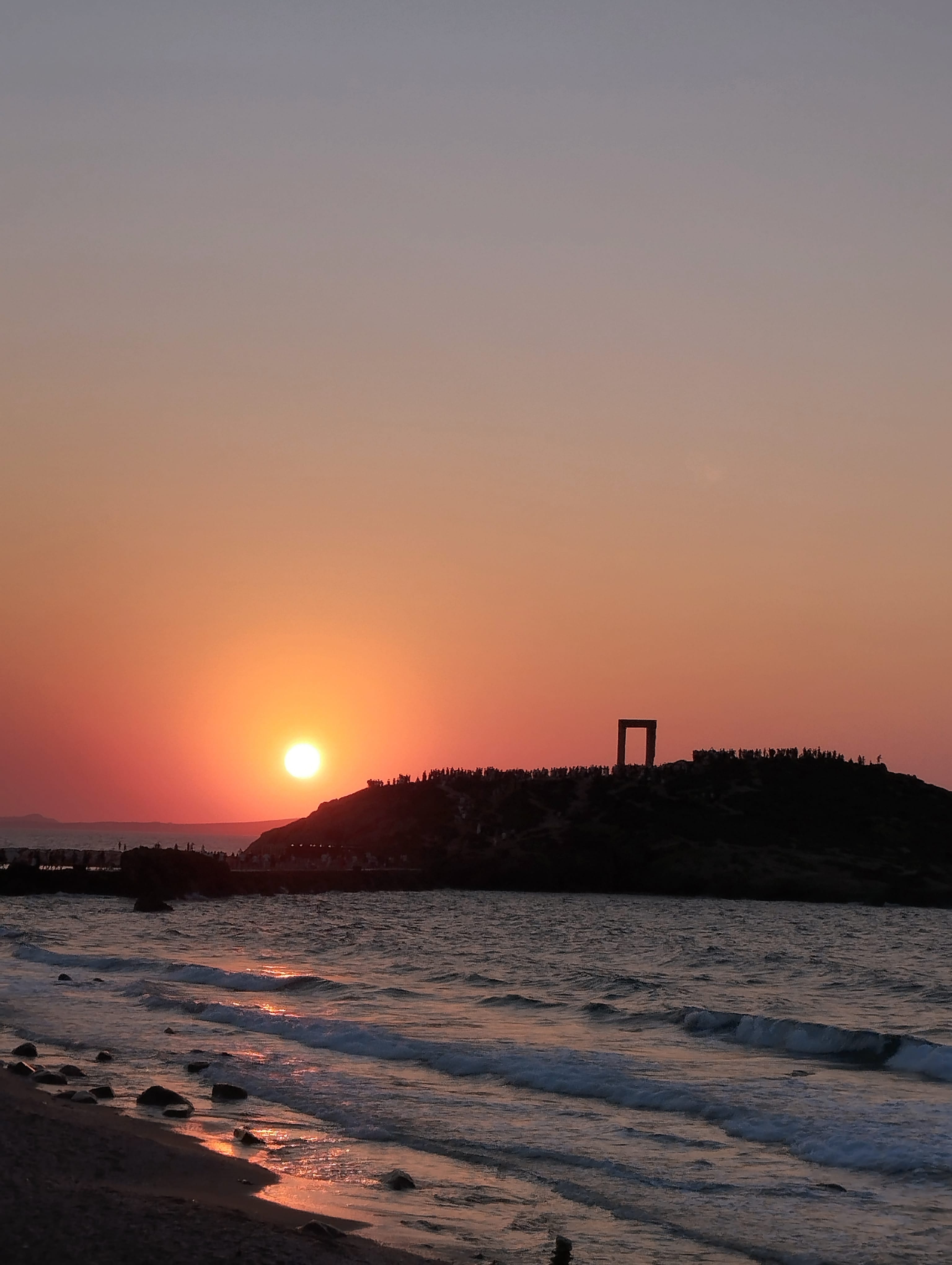 a beach with a sunset