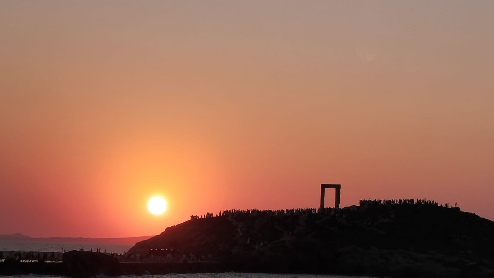 a beach with a sunset
