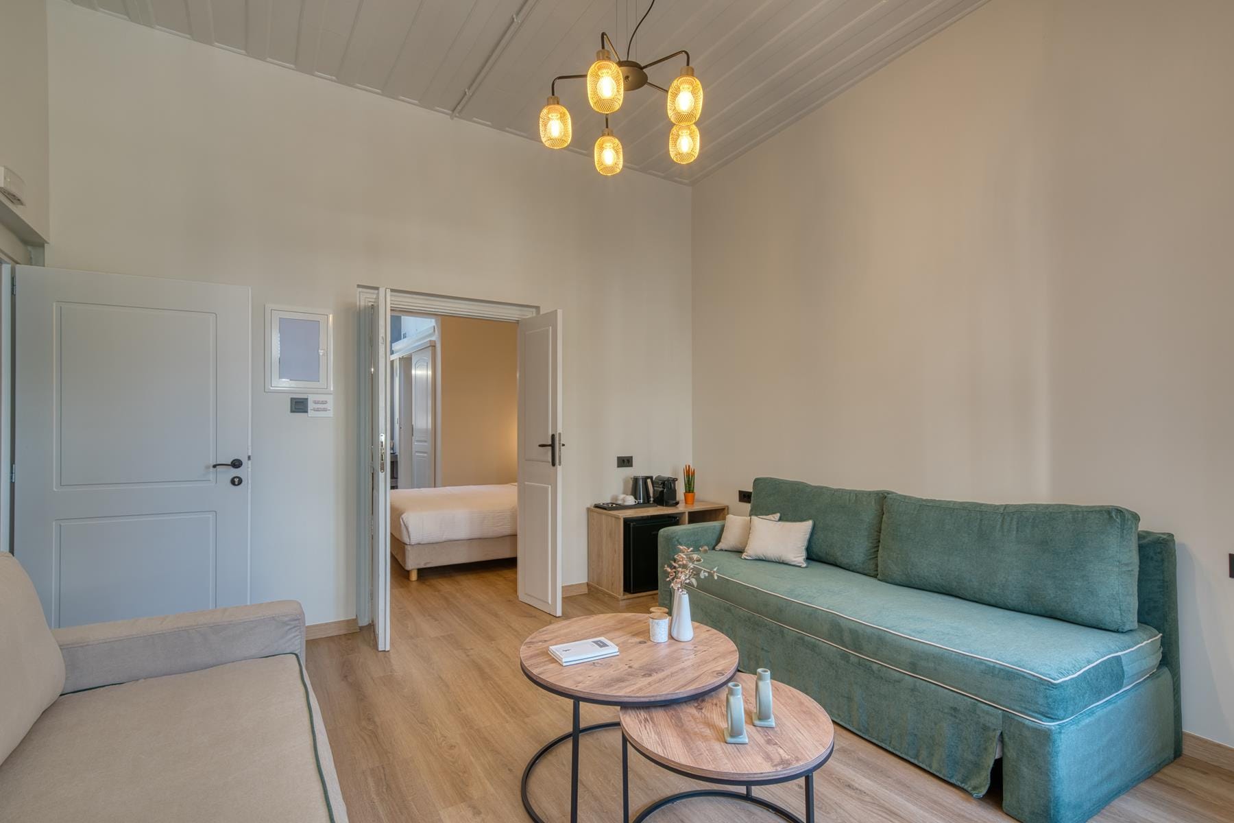 a living room with a green couch