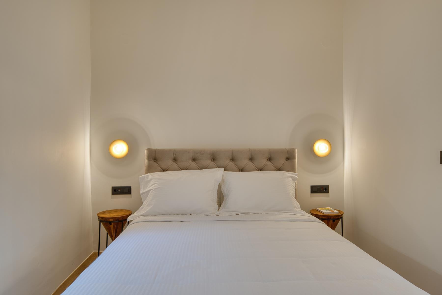 a bed with a white bed spread