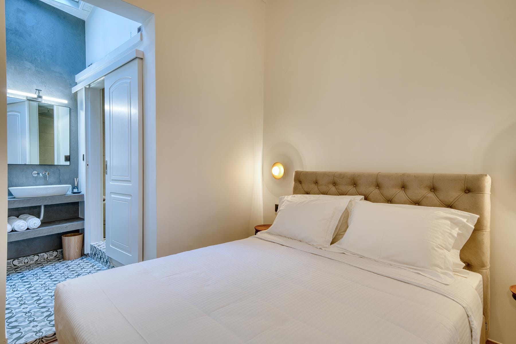 a bed with a white comforter