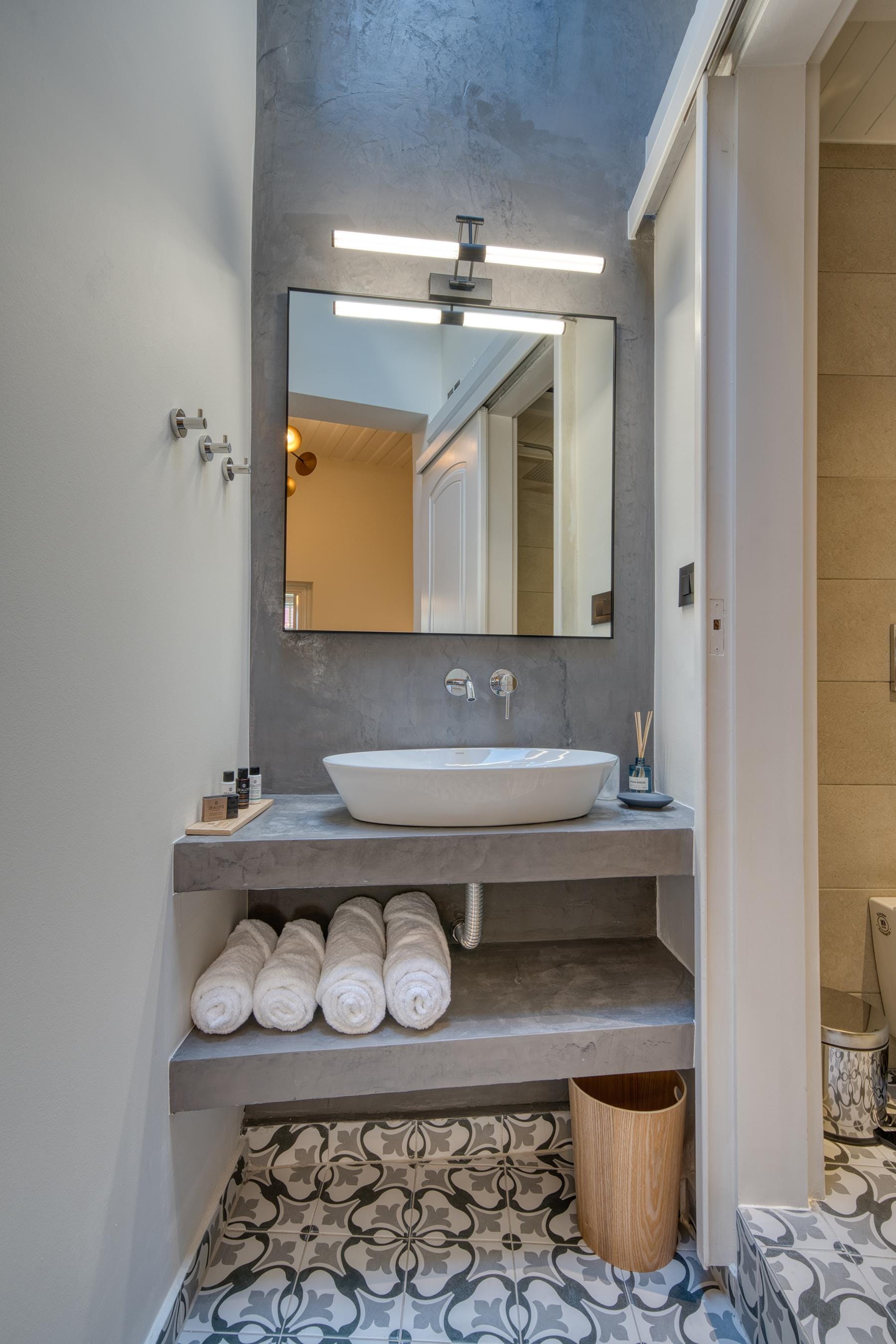 a bathroom with a mirror and a sink