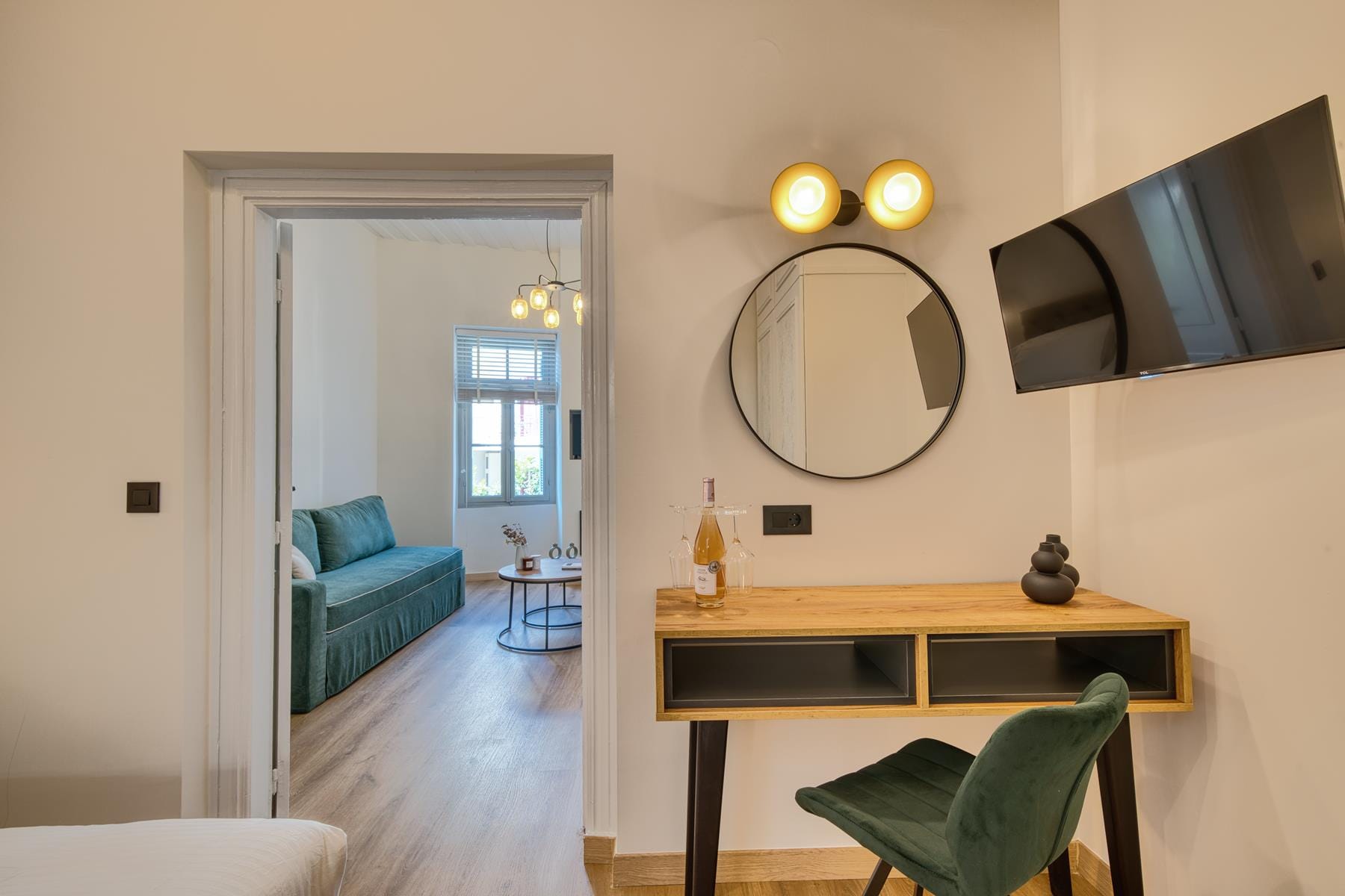 a room with a mirror and a desk