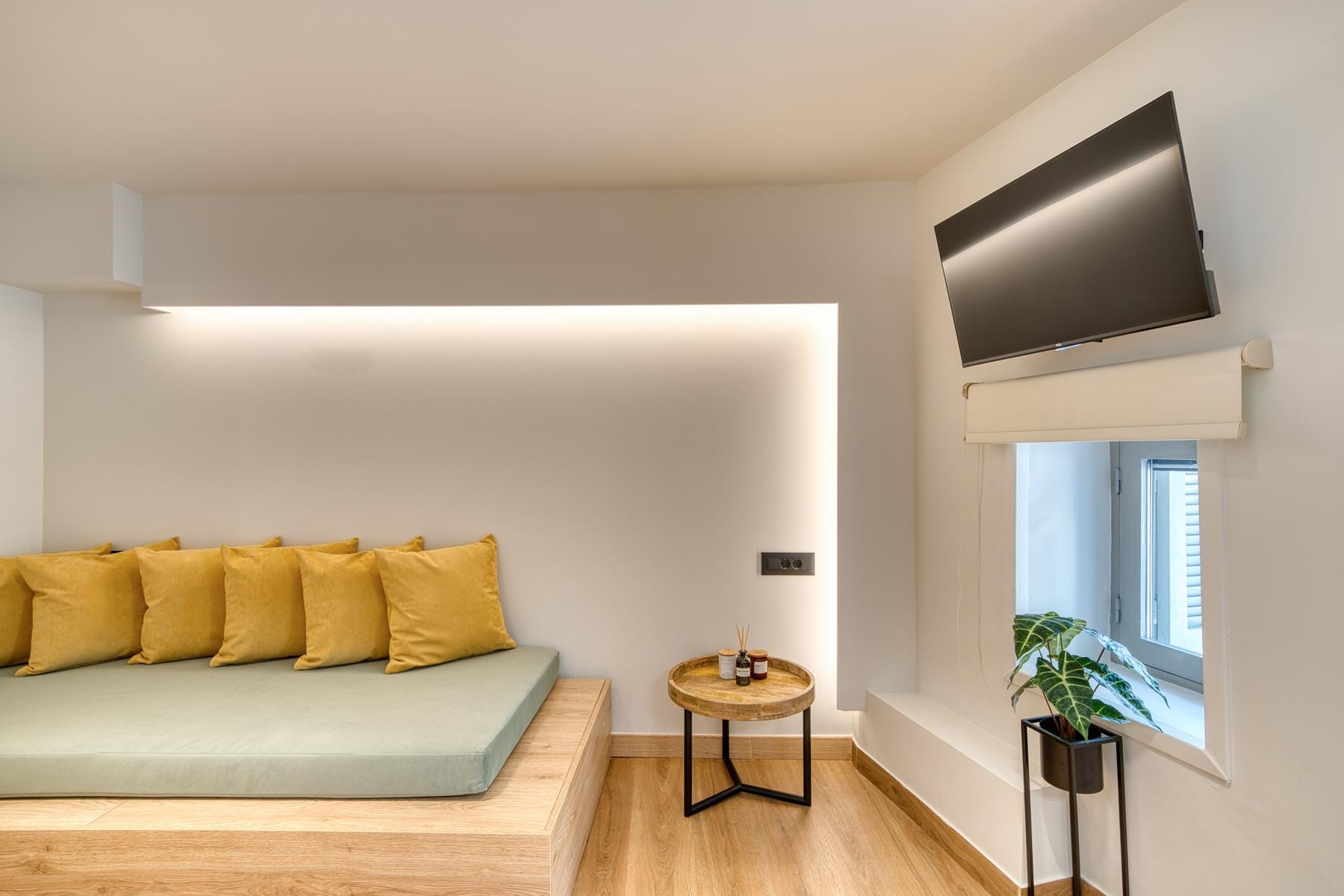 a room with a couch and a tv