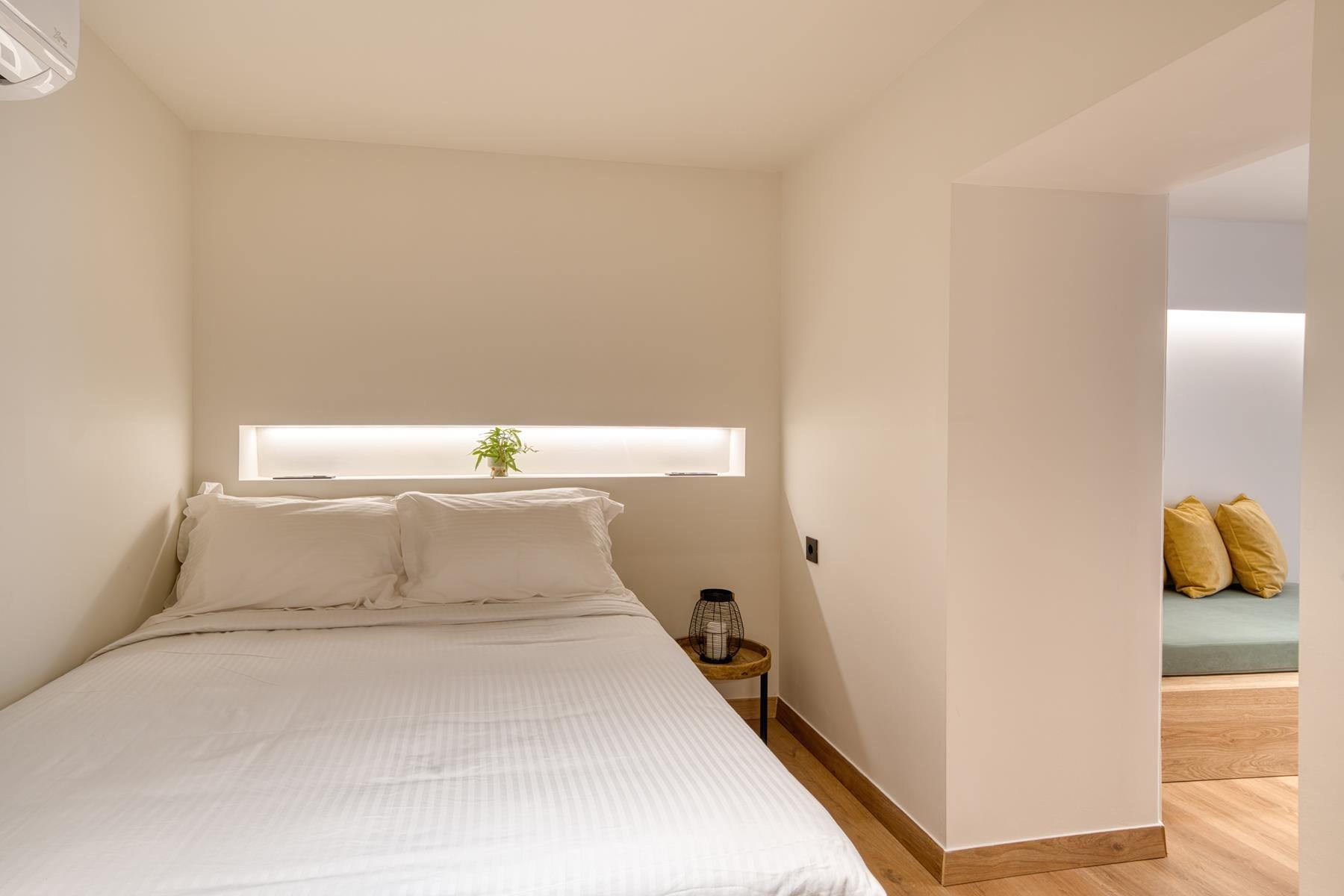 a bed with a white bed spread