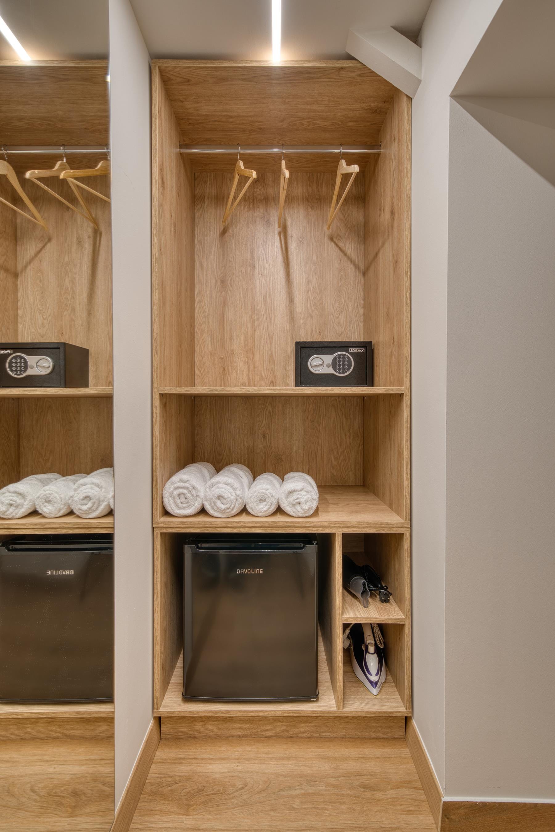a wooden shelf with a microwave and a microwave on it