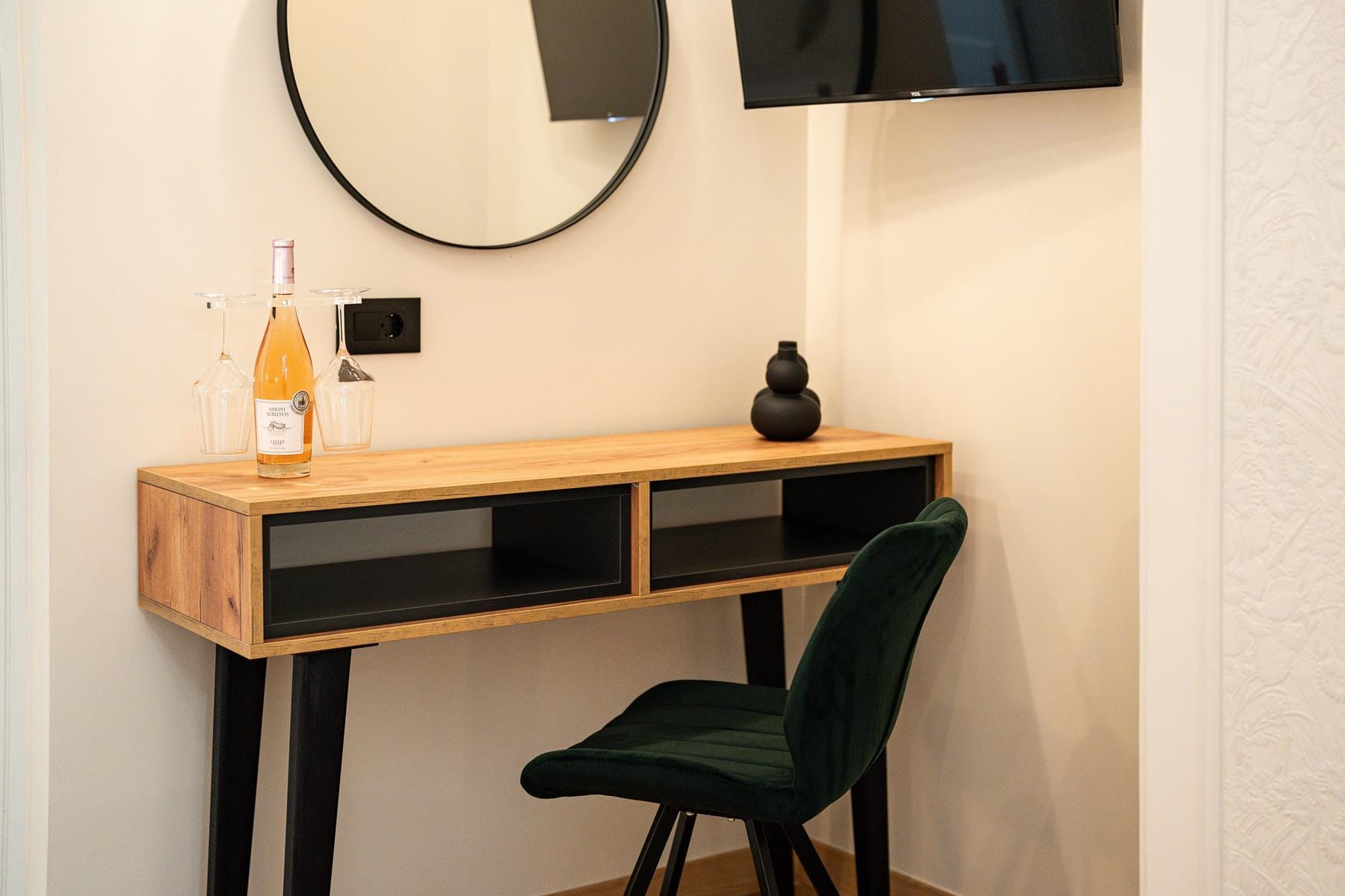 a desk with a chair and a mirror