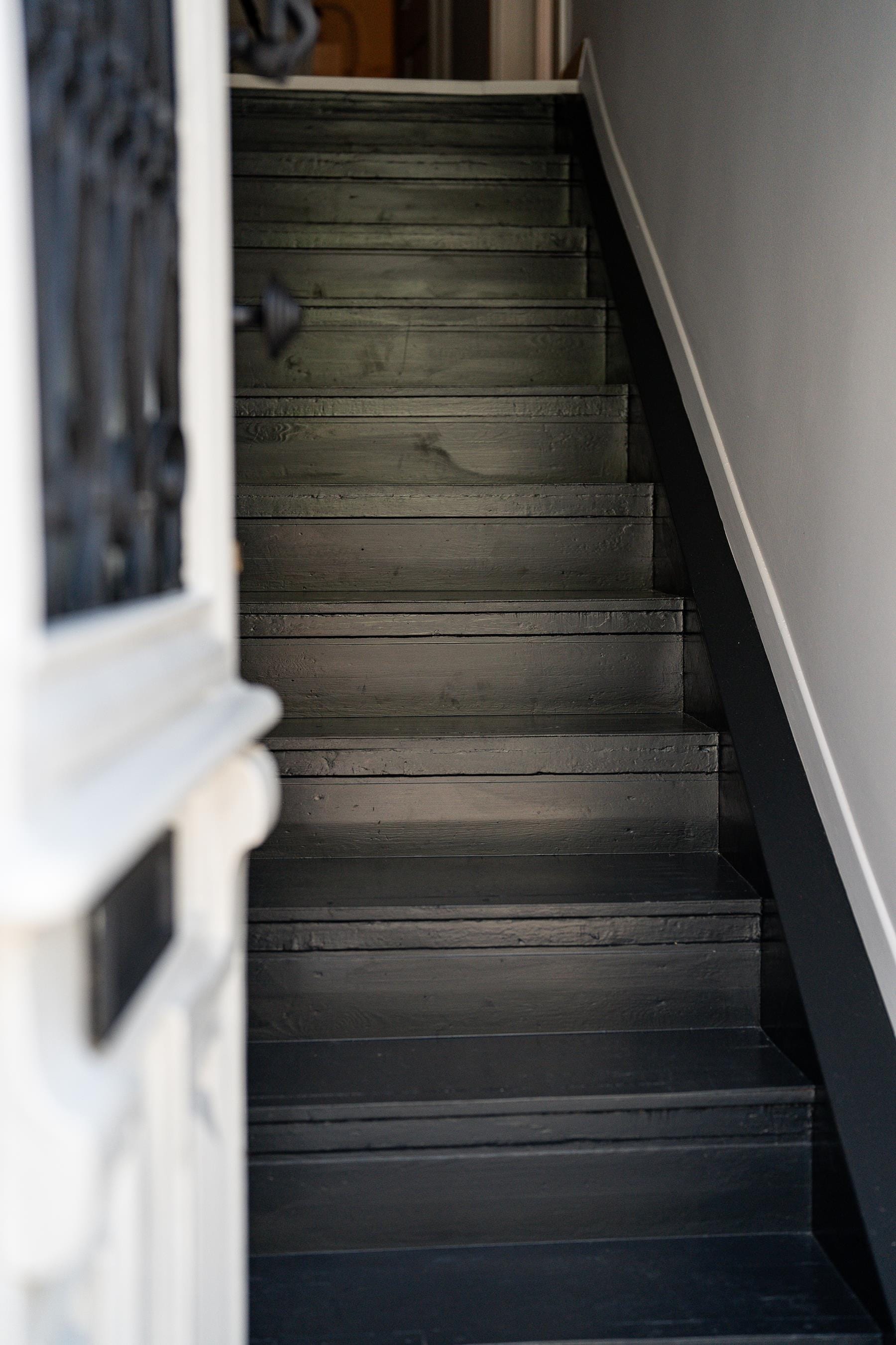 a wood staircase with a window