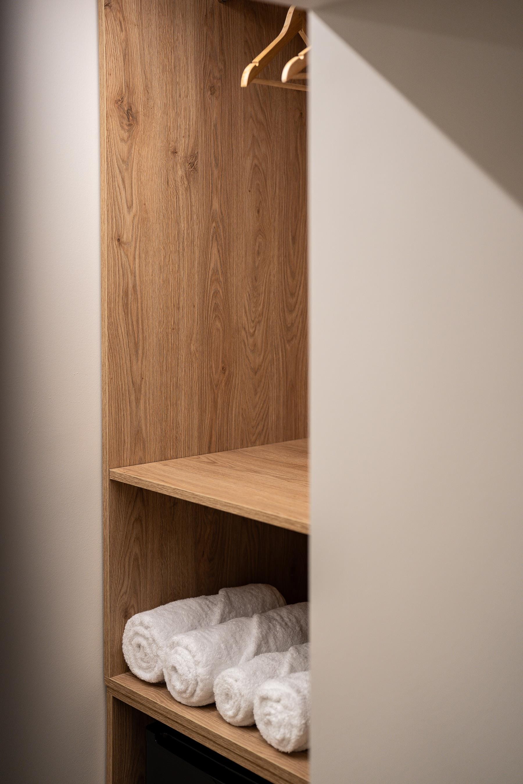 a shelf with stuffed animals on it
