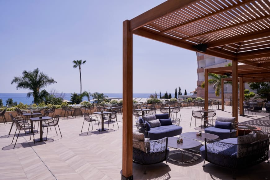 a patio with chairs and tables