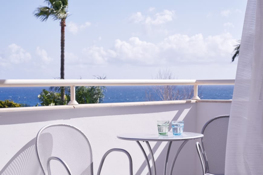 a table and chairs on a deck