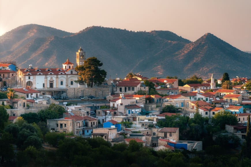 a city with a mountain in the background