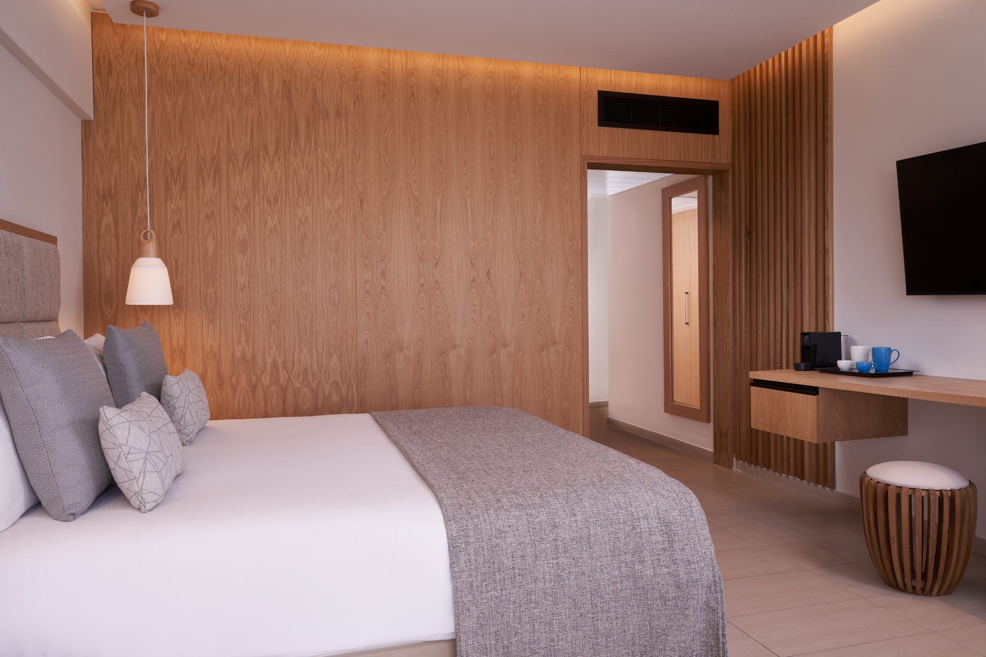 a bedroom with a bed and a tv