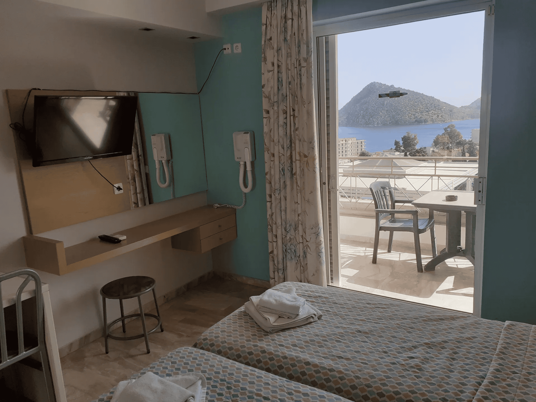 a bedroom with a bed and a table