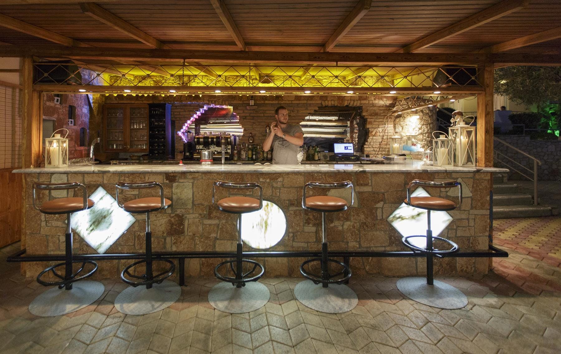 a person behind a counter with drums