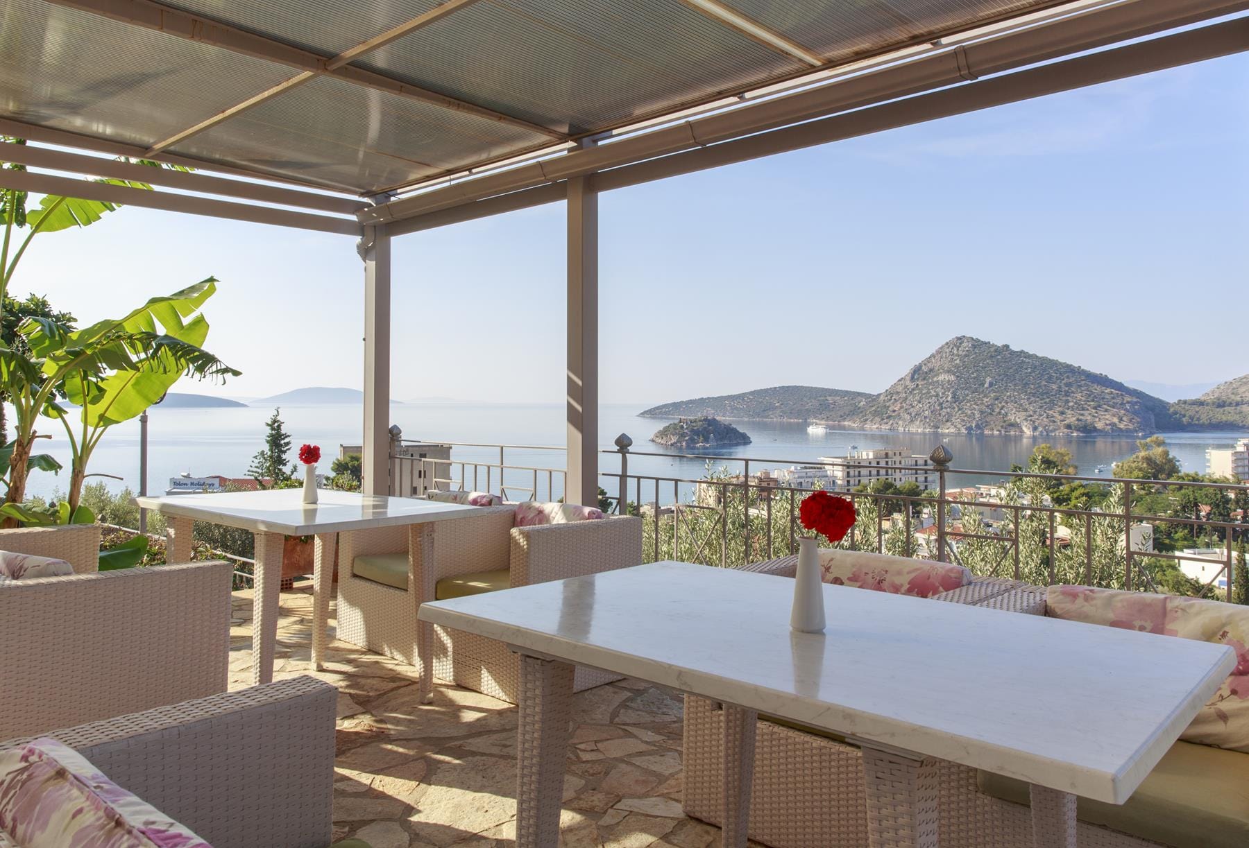a patio with tables and chairs